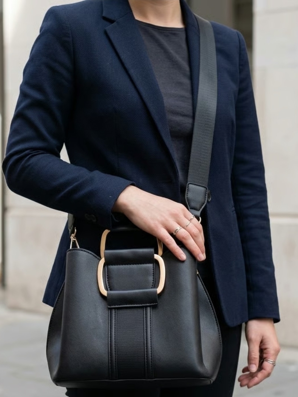 Structured Black Shoulder Bag with Gold Accent and Wide Strap